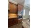Gourmet kitchen features stainless steel appliances, including built-in double ovens, and custom cabinetry at 2031 Basin St, Port Charlotte, FL 33952