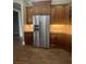 Kitchen featuring stainless steel refrigerator and custom wood cabinetry at 2031 Basin St, Port Charlotte, FL 33952