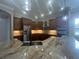 Gourmet kitchen boasts granite counters, stainless steel appliances, and custom cabinetry at 2031 Basin St, Port Charlotte, FL 33952