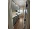Laundry room with modern gray cabinetry, countertops, sink, and washer/dryer at 2031 Basin St, Port Charlotte, FL 33952