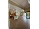 Open-concept living area that features a kitchen, living room, and access to the outdoors at 2031 Basin St, Port Charlotte, FL 33952