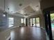 Spacious living room with sliding glass doors providing access to the outdoor pool area at 2031 Basin St, Port Charlotte, FL 33952