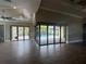 Open living space boasts tile floors, a large sliding glass doors to a screened patio, and plenty of natural light at 2031 Basin St, Port Charlotte, FL 33952