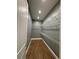 Walk-in closet featuring wire shelving, wood-look tile flooring, and recessed lighting at 2031 Basin St, Port Charlotte, FL 33952