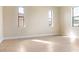 Bright bedroom featuring neutral color walls, tile flooring and bright windows at 23218 Fawn Ave, Punta Gorda, FL 33980