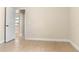 Bedroom view with neutral walls and view to hallway at 23218 Fawn Ave, Punta Gorda, FL 33980