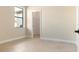 Bright bedroom with a window and views to the closet at 23218 Fawn Ave, Punta Gorda, FL 33980