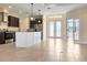 Open-concept kitchen featuring a center island, stainless steel appliances, and seamless transition to the living area at 23218 Fawn Ave, Punta Gorda, FL 33980