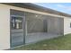 Enclosed screened patio offering ample space, ceiling fan, and views of the surrounding outdoor area at 23218 Fawn Ave, Punta Gorda, FL 33980