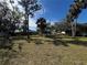 Expansive backyard featuring a mix of lush trees and ample space for outdoor activities, perfect for leisure at 2507 Linton Ln, Port Charlotte, FL 33952