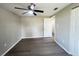 The bedroom boasts a ceiling fan, a neutral color scheme, modern floors, and is awash with natural light at 2507 Linton Ln, Port Charlotte, FL 33952