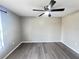 A cozy bedroom with modern flooring, neutral walls, and a ceiling fan for added comfort at 2507 Linton Ln, Port Charlotte, FL 33952