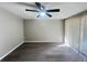 Bedroom featuring modern flooring, a ceiling fan, and sliding glass doors to the exterior at 2507 Linton Ln, Port Charlotte, FL 33952