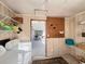 Practical laundry room offering washer, dryer and easy access to a sunroom for added convenience at 2507 Linton Ln, Port Charlotte, FL 33952