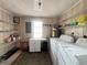 Functional laundry room with ample shelving, washer, and dryer, providing convenient space at 2507 Linton Ln, Port Charlotte, FL 33952