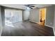 Inviting living room featuring modern flooring, a ceiling fan, patio access, and an adjacent bathroom at 2507 Linton Ln, Port Charlotte, FL 33952