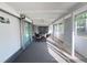 Enjoy the outdoors with this enclosed patio featuring comfortable seating, ceiling fan, and screened windows at 2507 Linton Ln, Port Charlotte, FL 33952
