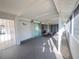 Relax on the enclosed patio with outdoor seating and a view of the fenced backyard at 2507 Linton Ln, Port Charlotte, FL 33952