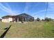 This large backyard offers a screened pool, privacy, and lush landscaping at 30035 Alder Rd, Punta Gorda, FL 33982