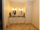 Bathroom featuring double vanity sinks, granite countertop and great lighting at 30035 Alder Rd, Punta Gorda, FL 33982