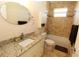Well-lit bathroom with granite countertops, modern fixtures, bathtub and shower at 30035 Alder Rd, Punta Gorda, FL 33982