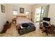 Bright and airy bedroom featuring lots of natural light with access to lanai at 30035 Alder Rd, Punta Gorda, FL 33982