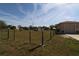 Large front yard with fence and shed at 30035 Alder Rd, Punta Gorda, FL 33982