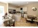 Eat-in kitchen with granite countertops, stainless appliances, white cabinetry, and breakfast nook at 30035 Alder Rd, Punta Gorda, FL 33982