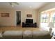 Bright living room features sliding glass doors to the pool area and neutral paint at 30035 Alder Rd, Punta Gorda, FL 33982