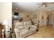 Relaxing living space connects to the kitchen, complete with tile flooring and a neutral color palette at 30035 Alder Rd, Punta Gorda, FL 33982
