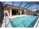 Soak up the sun by this gorgeous screened in pool with covered lanai at 30035 Alder Rd, Punta Gorda, FL 33982