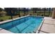 Backyard with a private, in-ground pool featuring clear blue water and tiled perimeter at 30035 Alder Rd, Punta Gorda, FL 33982