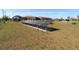 This property has an array of solar panels, saving on electric bills at 30035 Alder Rd, Punta Gorda, FL 33982