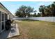 Spacious backyard featuring a well-maintained lawn and a private white fence at 3213 Belleville Ter, North Port, FL 34286