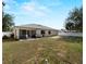 Expansive backyard with lush grass, enclosed by a white fence for added privacy at 3213 Belleville Ter, North Port, FL 34286