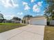 Inviting home featuring a spacious driveway and manicured front lawn at 3213 Belleville Ter, North Port, FL 34286