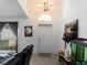 Inviting entryway with a chandelier and a black leather couch at 3213 Belleville Ter, North Port, FL 34286