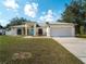 Attractive home featuring a well-manicured lawn and a convenient two-car garage at 3213 Belleville Ter, North Port, FL 34286