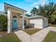 Inviting home exterior with a well-manicured lawn and an appealing blue front door at 3213 Belleville Ter, North Port, FL 34286