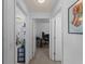 Hallway view featuring two rooms with computer setups at 3213 Belleville Ter, North Port, FL 34286