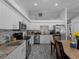 Spacious kitchen featuring stainless steel appliances, marble countertops and white cabinetry at 3213 Belleville Ter, North Port, FL 34286