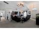 Bright and spacious living room with vaulted ceilings and neutral carpet flooring at 3213 Belleville Ter, North Port, FL 34286