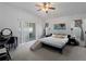 Inviting primary bedroom with neutral carpet and access to the backyard at 3213 Belleville Ter, North Port, FL 34286