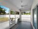 Covered patio featuring a ceiling fan and an outdoor seating area with a view of the yard at 3213 Belleville Ter, North Port, FL 34286