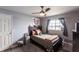 Bright bedroom features a large window, ceiling fan and a gray accent rug at 3310 Loveland Blvd # 1808, Punta Gorda, FL 33980