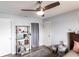 Bright bedroom with doors, ceiling fan and laminate wood flooring at 3310 Loveland Blvd # 1808, Punta Gorda, FL 33980