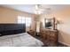 Bright bedroom with ceiling fan, new floors, furniture and natural lighting at 3310 Loveland Blvd # 1808, Punta Gorda, FL 33980