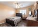 Bedroom with a ceiling fan, new floors, neutral walls and a wooden dresser at 3310 Loveland Blvd # 1808, Punta Gorda, FL 33980