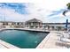 Community pool features ample seating, a covered gazebo, and views of the surrounding lakefront property at 3310 Loveland Blvd # 1808, Punta Gorda, FL 33980