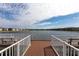 View from the lakefront community dock, showcasing tranquil waters and waterfront residences at 3310 Loveland Blvd # 1808, Punta Gorda, FL 33980
